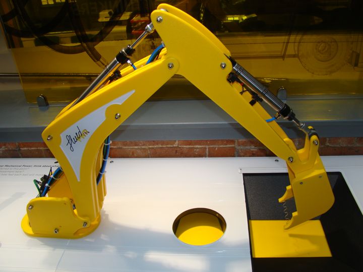 The demonstration digger arm above its activity surface.