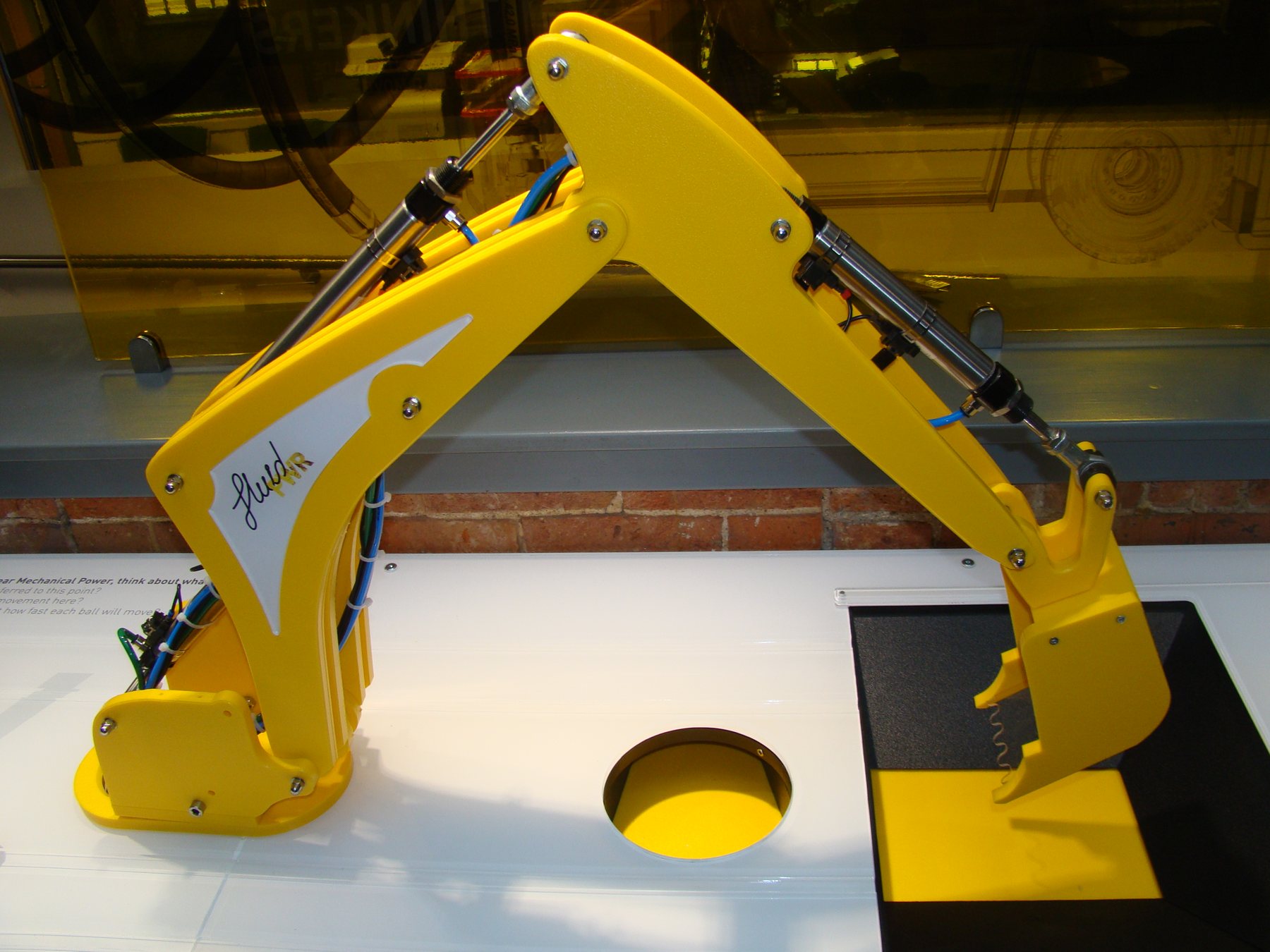 The demonstration digger arm above its activity surface.