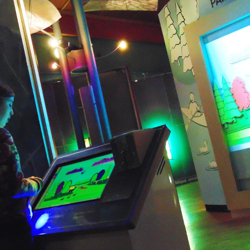 The touchscreen console and illuminated landscape scene.