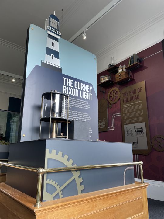 The lighthouse-themed structure and map display.