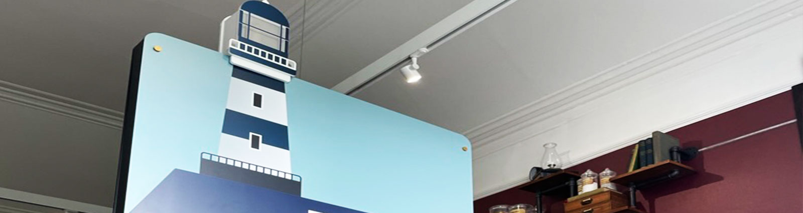 The completed lighthouse exhibit installed beside other heritage displays.