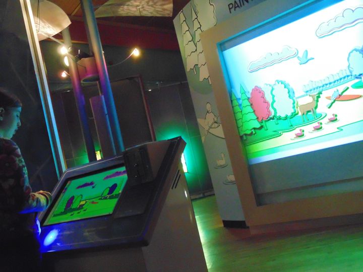 The touchscreen console and illuminated landscape scene.
