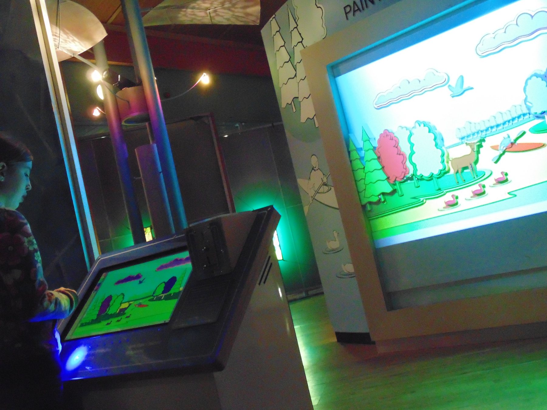 The touchscreen console and illuminated landscape scene.
