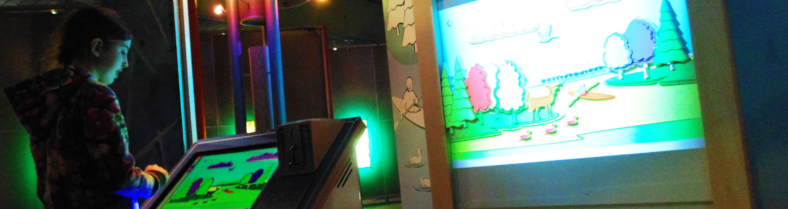 The touchscreen console and illuminated landscape scene.