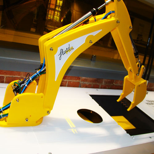 The demonstration digger arm above its activity surface.