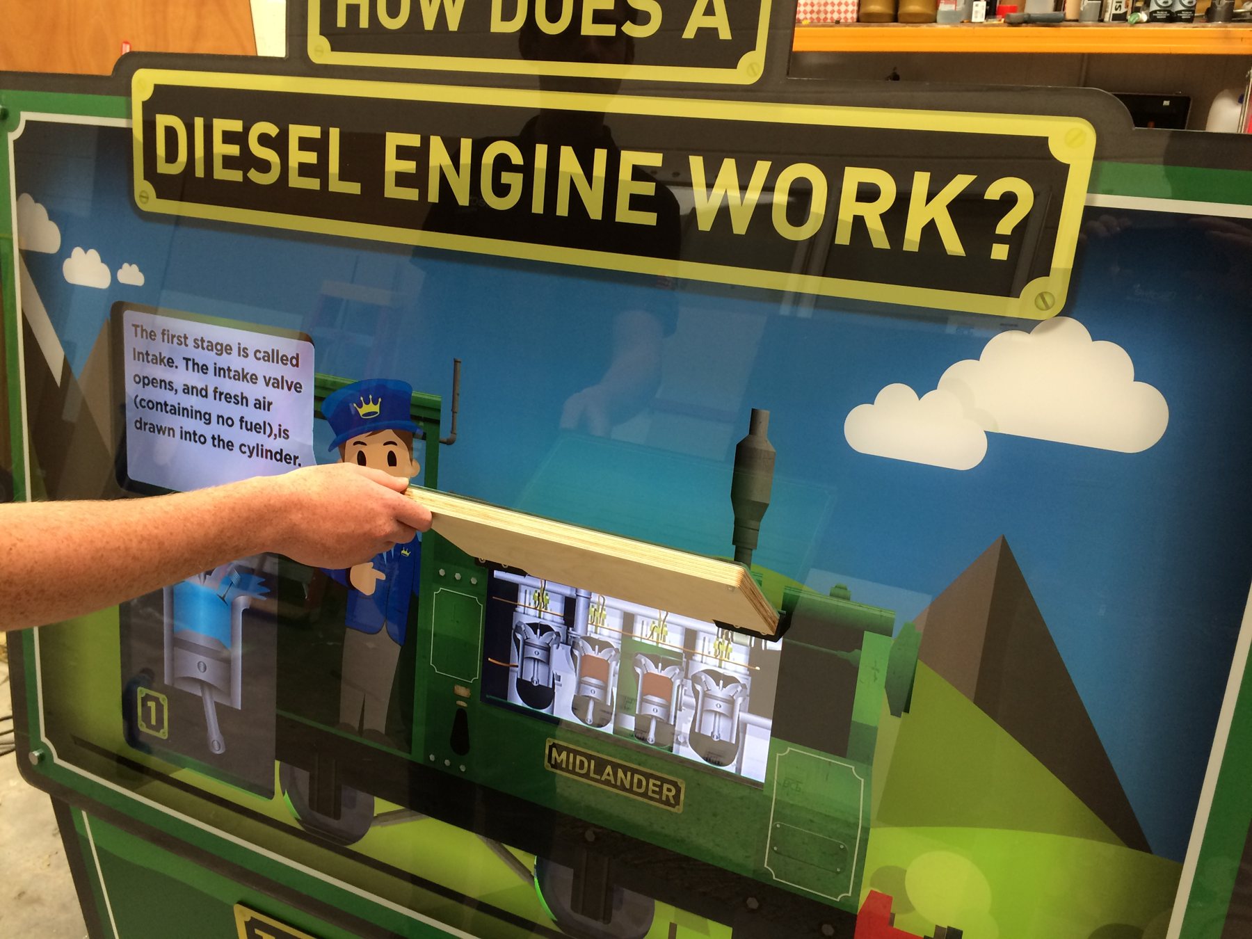 Lifting the bonnet to reveal the animated diesel engine.