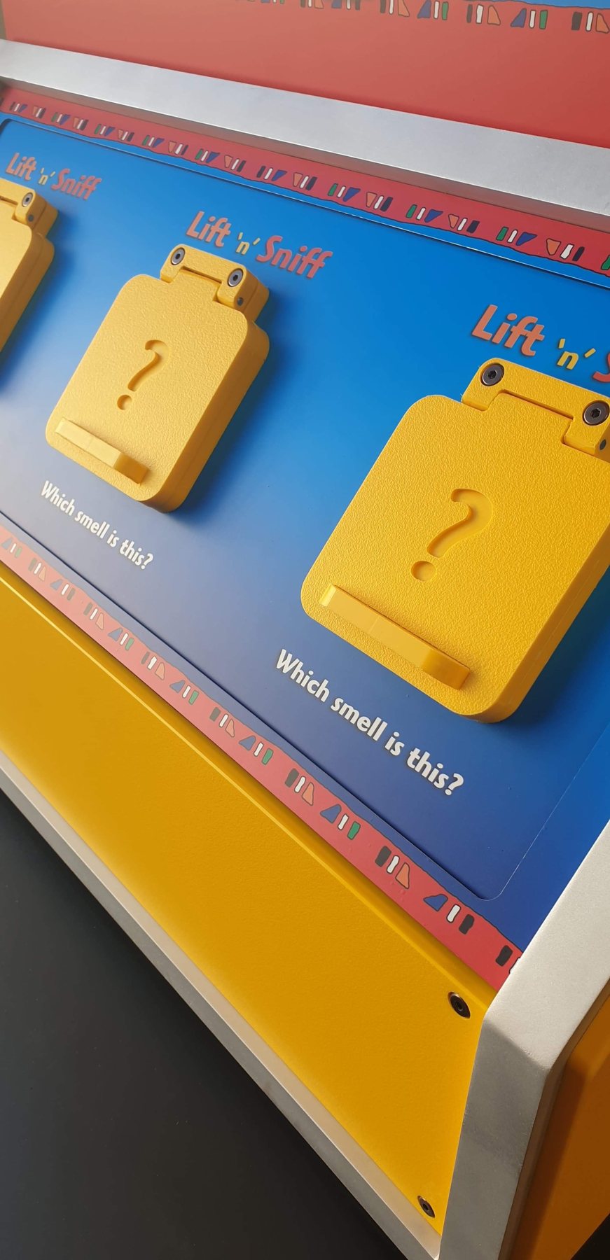 Lift-up flaps on the angled activity surface.