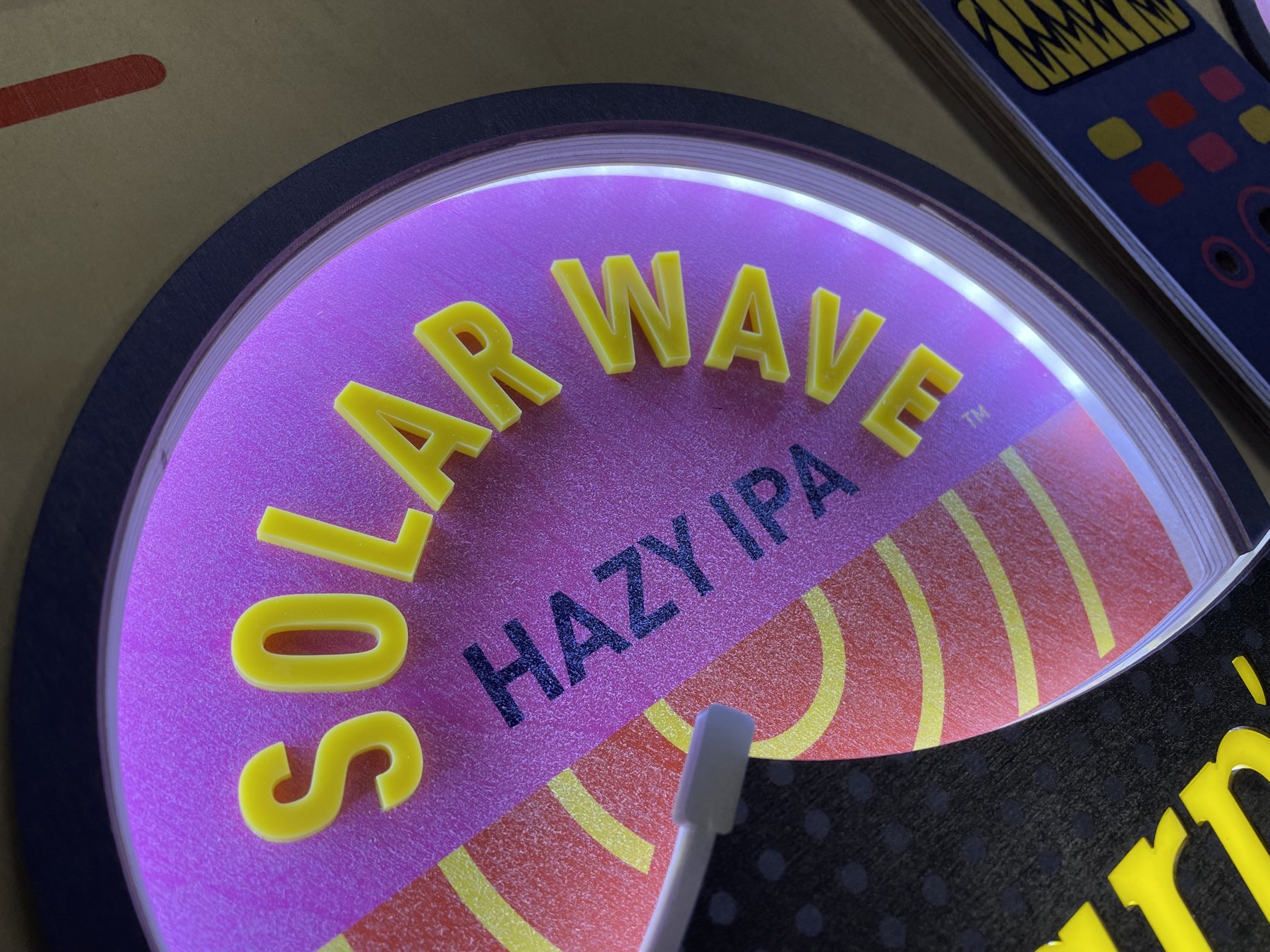 Sharp’s Brewery Event Display: close-up of the illuminated Solar Wave branding.