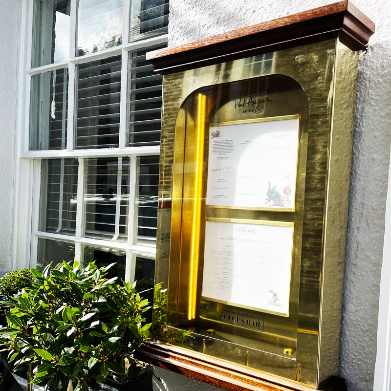 Bespoke brass menu system to a custom design with illumination