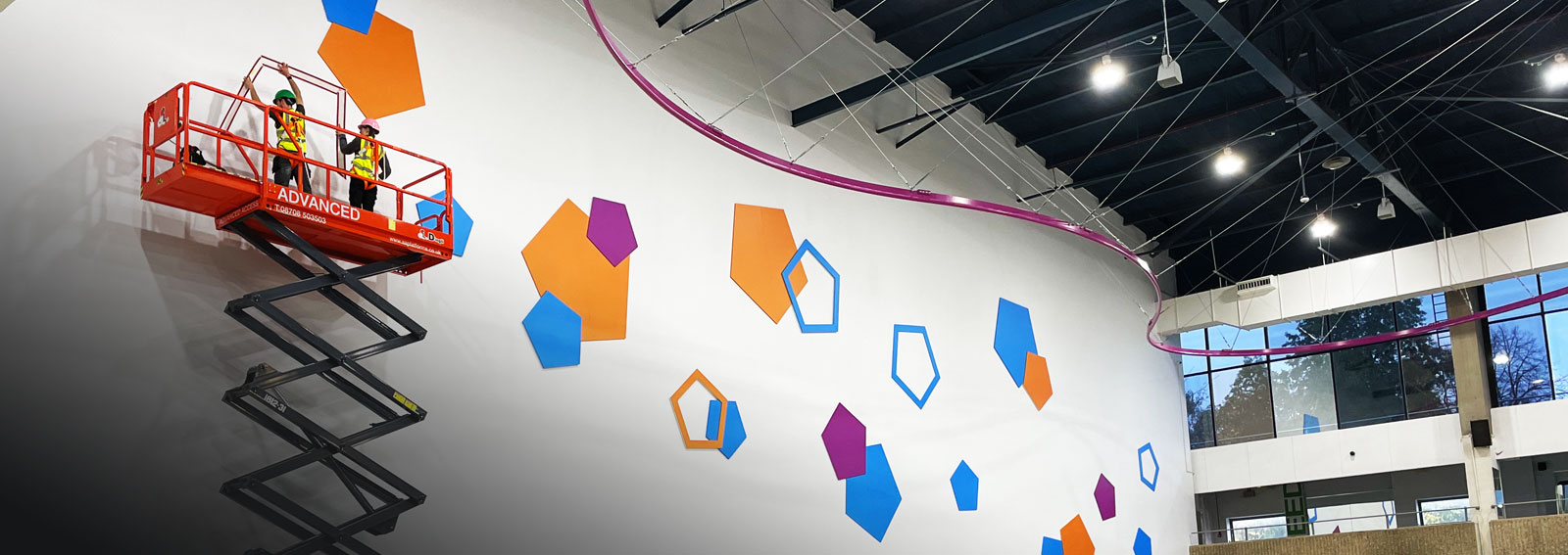 Large leisure facility wall branding and signage