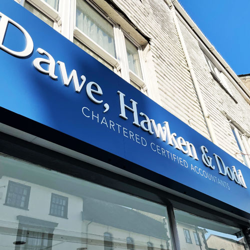 Raised lettering on shop fascia sign for accountants in Callington, Cornwall