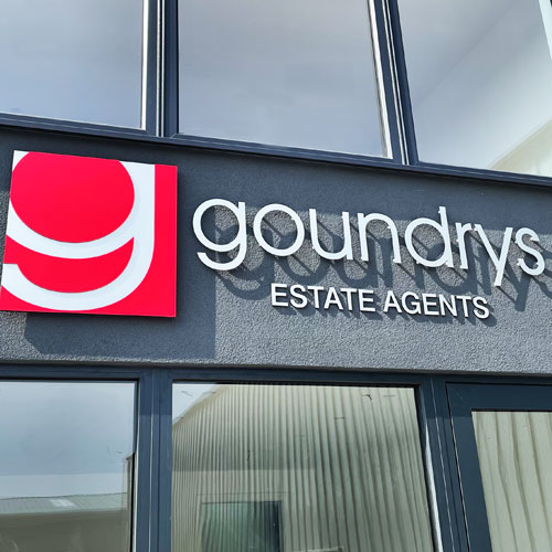 Raised 3D sign lettering for Goundrys Estate Agents shop in Truro with large red logo sign panel