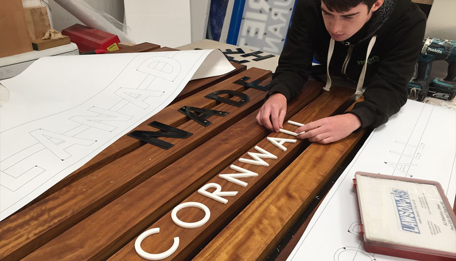 Cornwall sign maker installing 3D sign letters for hotel sign in Newquay Cornwall