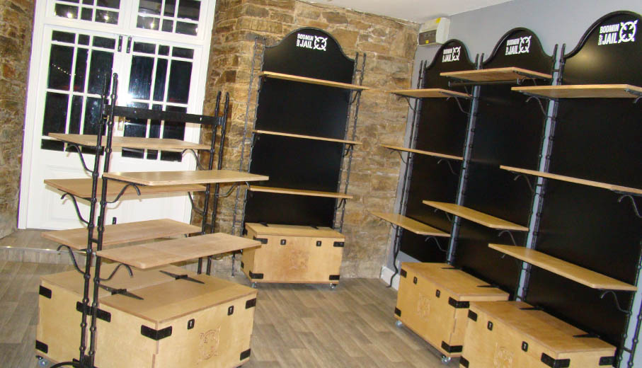 Bespoke heritage shop shelving system with storage boxes