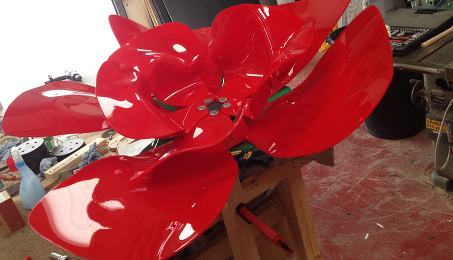 Giant arcylic heat formed poppy being manufactured
