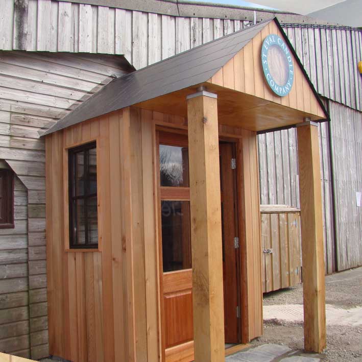 custom built porch for retail candle shop with feature posts