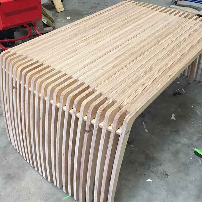 CNC cut extending wooden table for office