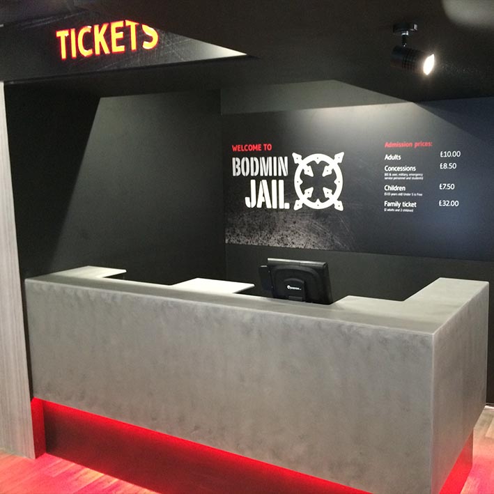 illuminated ticket desk with sign