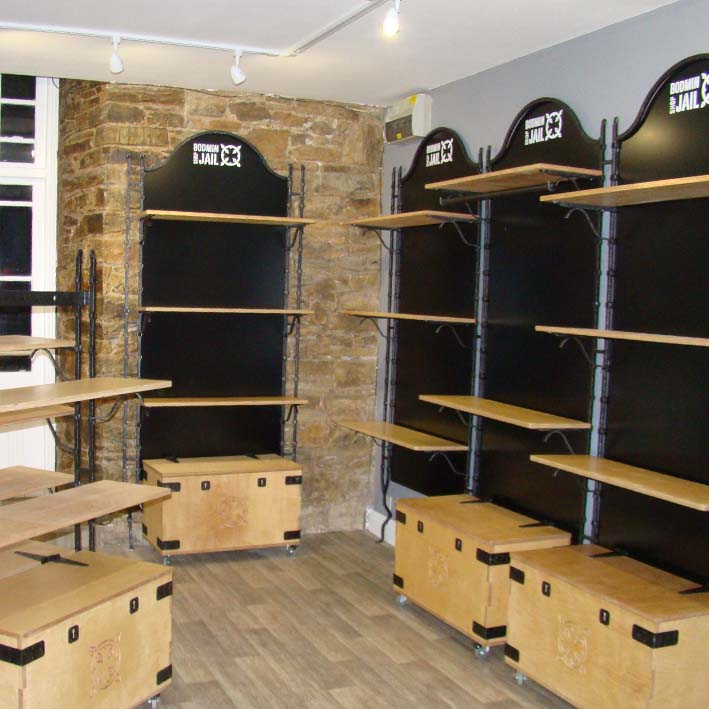 heritage style bespoke shop shelving system with storage boxes
