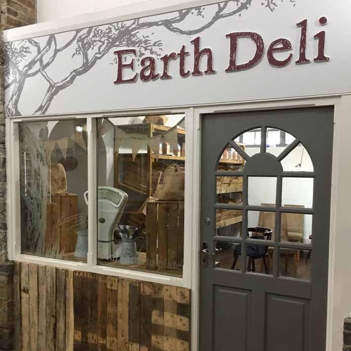 Earth deli shop sign in Launceston Cornwall