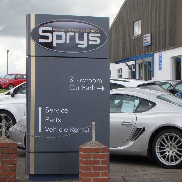 Car sales forecourt signs and large illuminated monloith signs for Sprys of Launceston Cornwall.